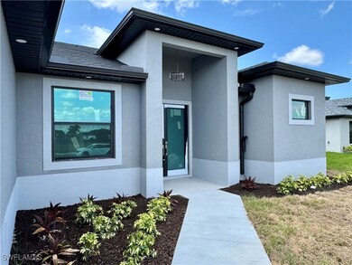 View of exterior entry featuring stucco siding and