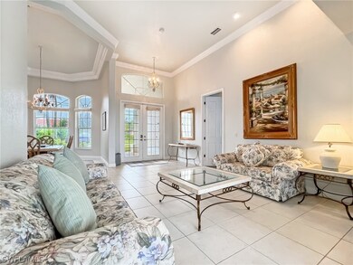 Open living and dining/den. Notice the tall tray ceilings