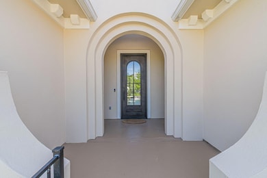 Entrance to property with stucco siding