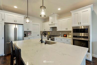 Elegant gleaming surfaces, abundant storage and workspace, marvelous lighting both natural and artificial, and a great layout all combine to make this kitchen and house a fabulous new home for you!