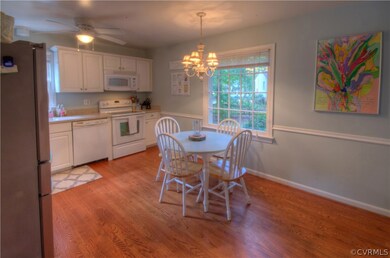 Eat-in Kitchen has Ceiling Fan with Light, Smooth Top Range, Built-in Dishwasher, Built-in Microwave, Double Sink with Garbage Disposal