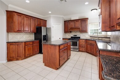 Kitchen with appliances with stainless steel finis