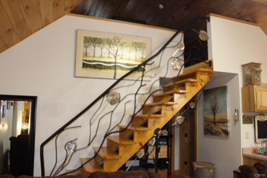 Stairway to loft with metal decorative rail