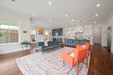 The living room offers a vibrant space where art,