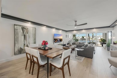 Dining area featuring light wood-type flooring and a ceiling fan