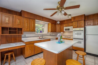 Center island with breakfast bar and Desk area.