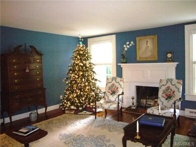 Living room & fireplace with a beautiful mantel - 