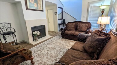 The living room is one level, wood burning fireplace, new paint window treatments, stairwell.  Clean & bright.  Priced to sell quickly