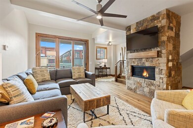Living room with stone fireplace