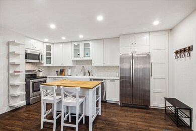 The beautiful kitchen provides an abundance of cab