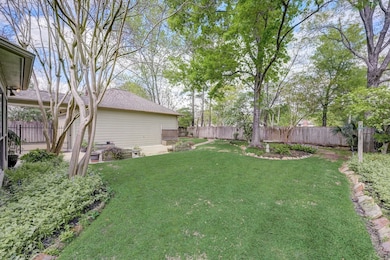 Manicured beds and plenty of room for the animals in the backyard.