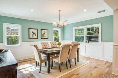 The formal dining room is large enough for enterta