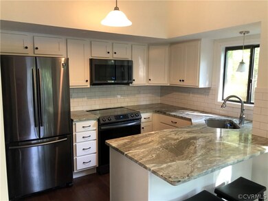 Granite counters, tile caksplash, black stainless