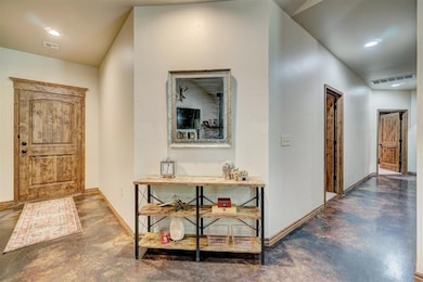 Foyer featuring concrete flooring