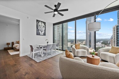 Living area featuring dark wood-type flooring, a 