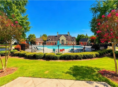 Community pool with a patio