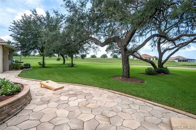 The expansive and artfully designed back yard is q
