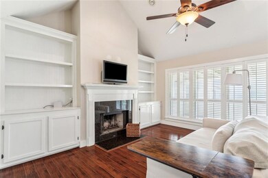Living room with built-ins.  Plantation Shutters!