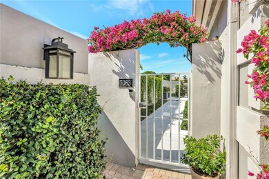 Details featuring stucco siding and a gate