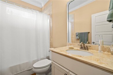 Guest bathroom with cultured marble countertops