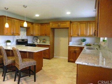 Kitchen with new travertine flooring.
