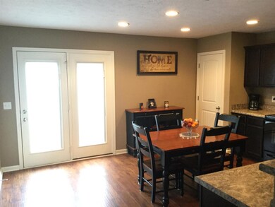 French doors in kitchen lead to patio.  Door on right is to a large pantry.  