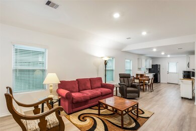 Step into the cozy living room, featuring natural