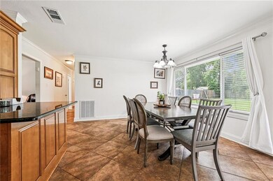 Spacious and sunlit dining area with oversized win