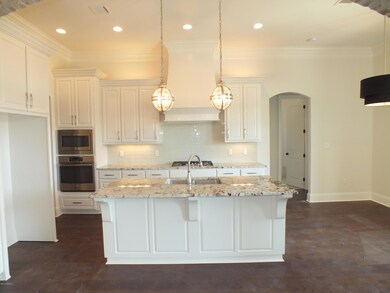 Kitchen with Arched brick entry way