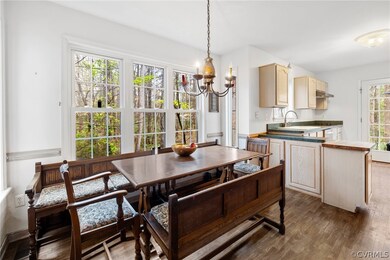 Kitchen dining area with triple window which allow