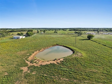 Overview of rural landscape featuring a nearby body of water