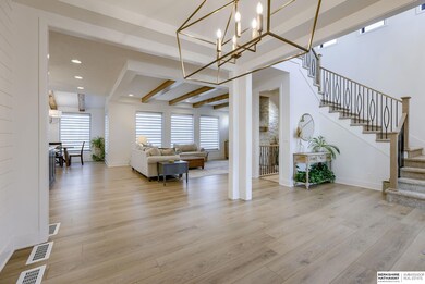 Ceiling treatments, dramatic light fixtures, warm colors, beautiful flooring throughout the home, stunning tile!