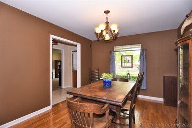 Dining room accommodates a large table and has bea