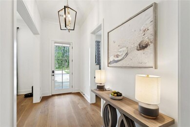 Foyer, wood floor and 11' ceiling