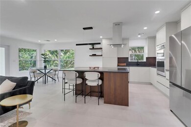 Kitchen with island range hood, a sink, modern cab