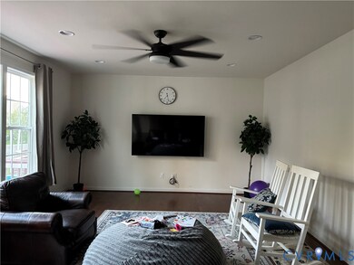 Living room featuring wood finished floors, ceiling fan, and recessed lighting