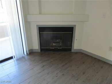 Interior details with a glass covered fireplace, b