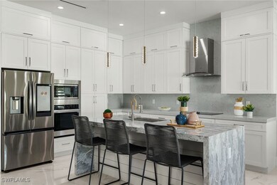 Kitchen featuring white cabinets, a kitchen breakf