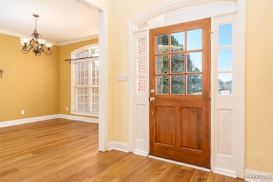 View of the foyer and dining room.  Beautiful new floors and view of the abundance of natural light that flows throughout the home.