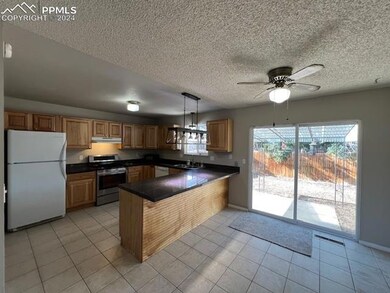 Kitchen with kitchen peninsula, pendant lighting, 