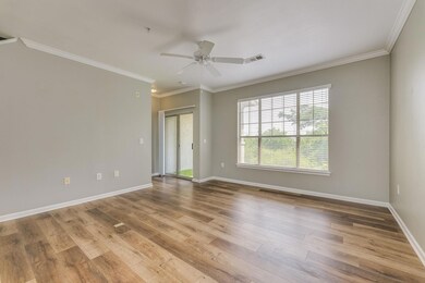 Empty room with ceiling fan, ornamental molding, 