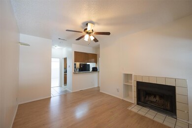 Unfurnished living room with visible vents, a tex