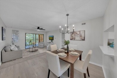 Enter into your open concept living/dining space down the hallway and past the generous sized kitchen to unwind from the day