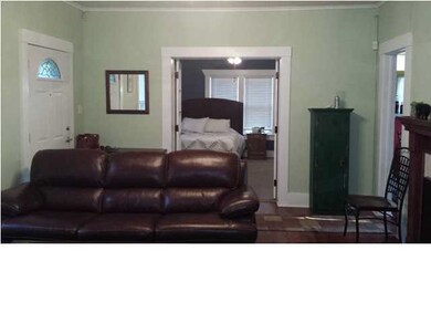 Master is off the living room with french doors.