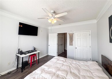 Bedroom featuring dark wood-type flooring, ornamen