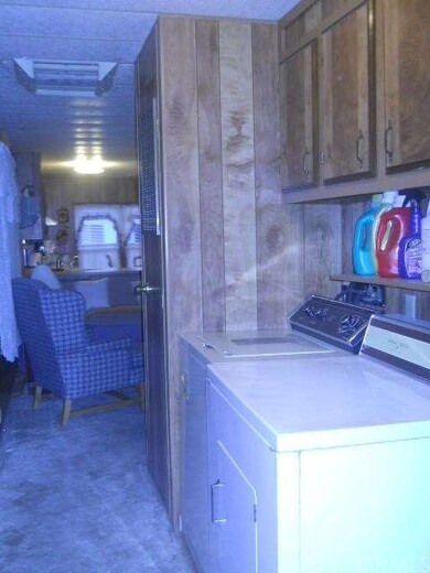 Washer and dryer located in hall by the door out t