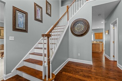 Enter into this spacious foyer with hardwood floor