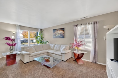 Living area with carpet floors and baseboards