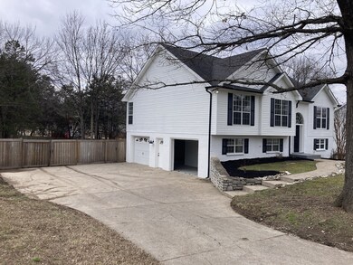 Two car garage with large area in driveway.