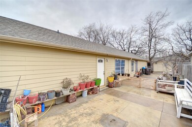 Rear view of property with a storage shed and a pa